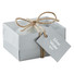 Candela a forma di sasso in scatola regalo di cartone colore grigio